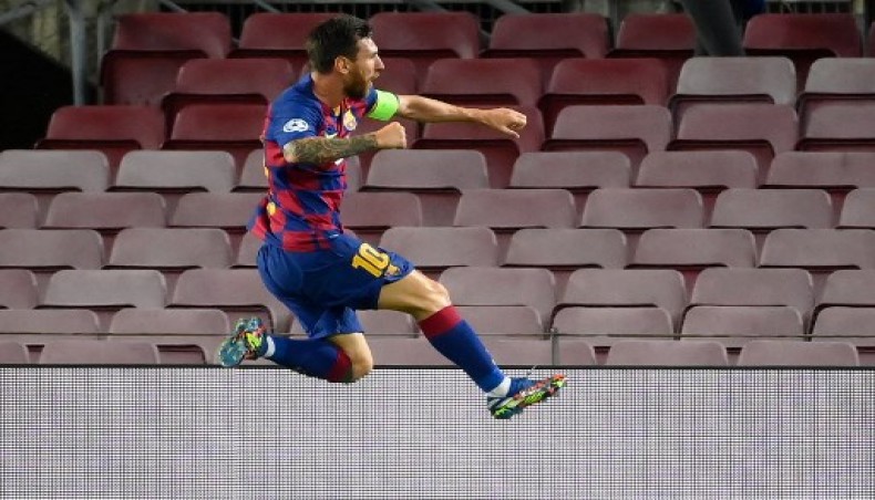 Barcelona captain Lionel Messi celebrates after scoring his team’s second goal against Napoli during their UEFA Champions League round of 16 second-leg match at the Camp Nou on Saturday. — AFP photo