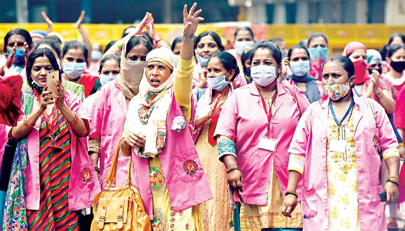 Accredited Social Health Activist shout slogans during a protest to draw attention to their plight of underpayment and lack of protection from the COVID-19 coronavirus infection, in New Delhi on Sunday. — AFP photo