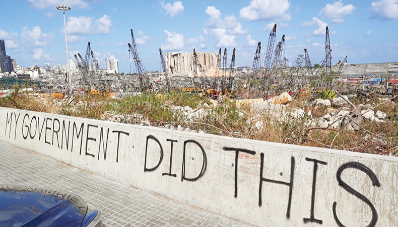A picture, taken on Sunday, shows graffiti on the wall of a bridge overlooking the port of Beirut, the site of the explosion which killed at least 154 people and devastated swathes of the capital. — AFP photo