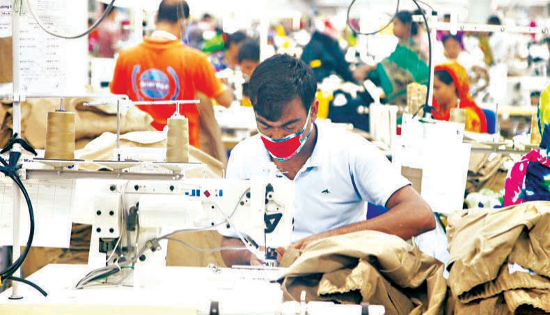 A file photo shows readymade garment workers sewing clothes at a factory on the outskirts of Dhaka. Readymade garment workers in Bangladesh lost wages worth around $501 million for three months, March to May, due to the coronavirus pandemic, according to a global report published on Monday.— New Age photo