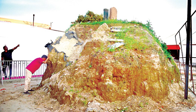 A man leans over of a mound of soil inside the proposed area for a Ram temple, where India’s prime minister Narendra Modi took part in the ceremony of laying the foundation stone of the temple, in Ayodhya on August 5. — Agence France-Presse/Sanjay Kanojia
