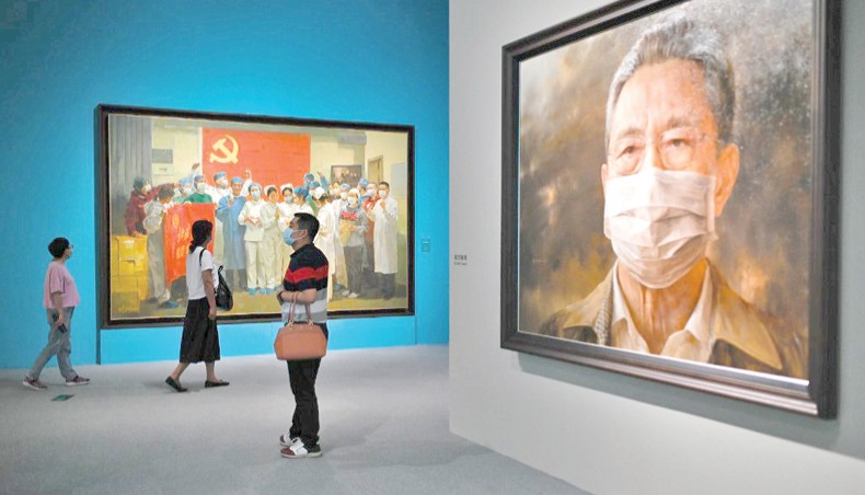 People visit the art exhibition ‘Unity is strength: An art exhibition on the fight against COVID-19’ on the fight against the coronavirus at the National Museum of China in Beijing on August 5, 2020. — AFP photo