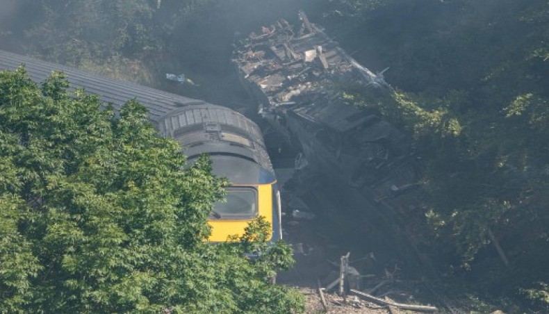 Derailed carriages are seen at the scene of a train crash near Stonehaven in northeast Scotland on August 12, 2020.- AFP photo
