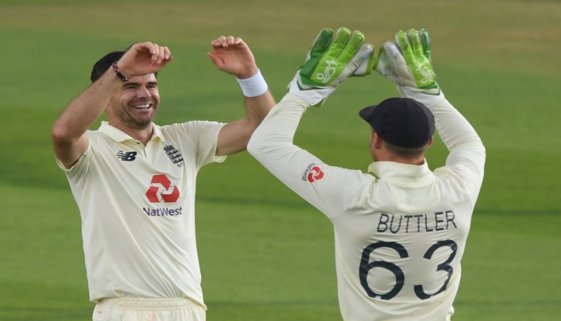 England pacer James Anderson (L) celebrates the wicket of Pakistan's Azhar Ali with team-mate Jos Buttler on the first day of their second Test at the Ageas Bowl in Southampton. — AFP photo