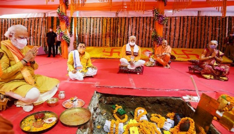 In this handout photograph taken on August 5, 2020, and released by the Indian Press Information Bureau India's prime minister Narendra Modi (L) performs a religious ritual during the groundbreaking ceremony of a grand Hindu temple in Ayodhya.- AFP photo