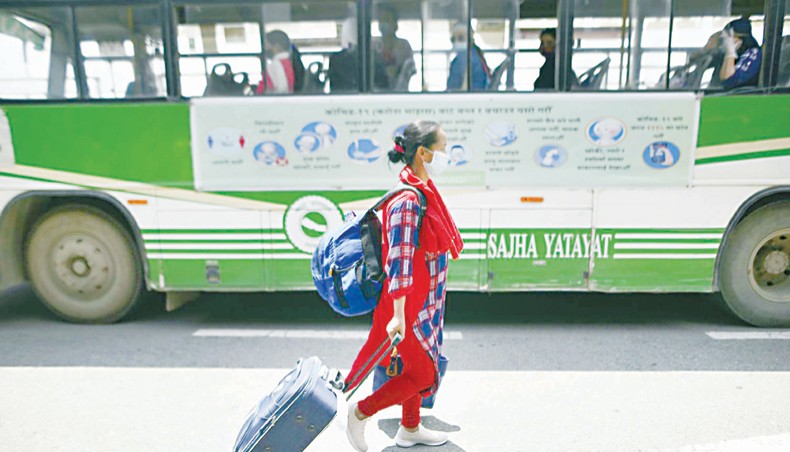 A Nepalese worker arrives at the Tribhuvan International Airport from Kuwait amid the COVID-19 pandemic in Kathmandu on June 11. — PA Images/Nur Photo/Narayan Maharjan