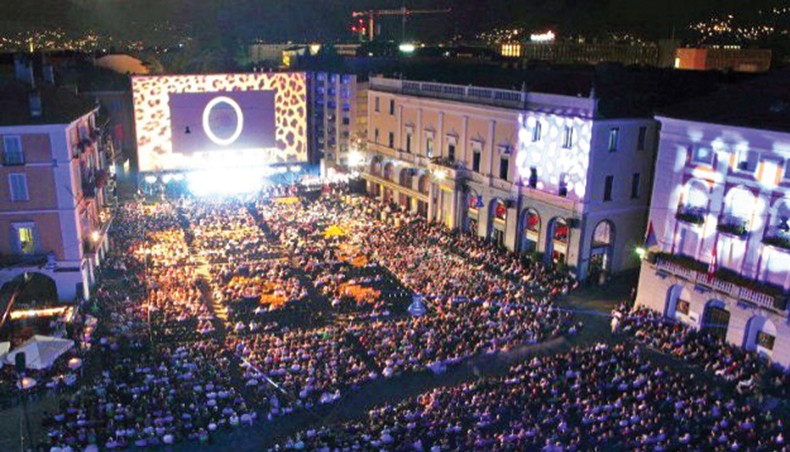 File photo shows audience attend a screening at The Piazza Grande open air venue at Switzerland’s Locarno Film Festival. — AFP photo