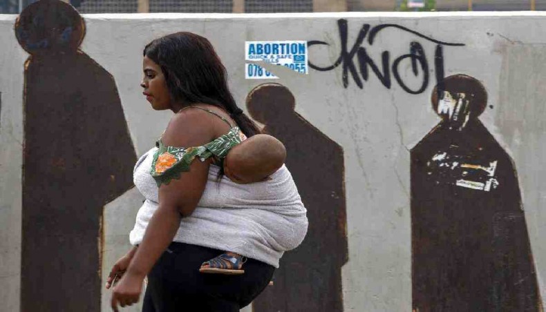 People walk along a downtown street in Johannesburg, South Africa.Millions of women and girls globally have lost access to contraceptives, abortion services and related care because of the coronavirus pandemic. -AP Photo