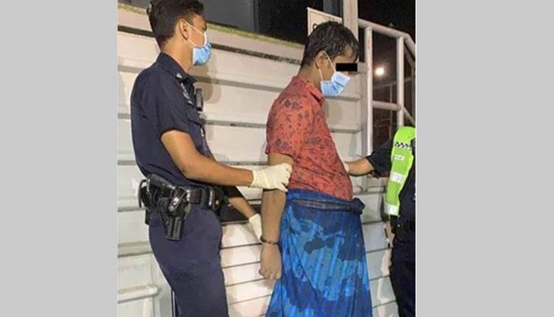 Checkpoint officers at Woodlands Checkpoint arrest a Bangladeshi man on Tuesday for attempting to illegally depart Singapore by swimming towards Malaysia. — Immigration and Checkpoints Authority