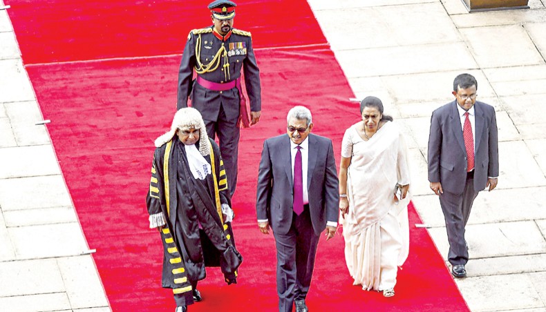 Sri Lankan president Gotabaya Rajapaksa, centre, arrives with his wife Ioma Rajapaksa, second from right, at the national Parliament in Colombo on August 20. — Agence France-Presse/Ishara S Kodikara