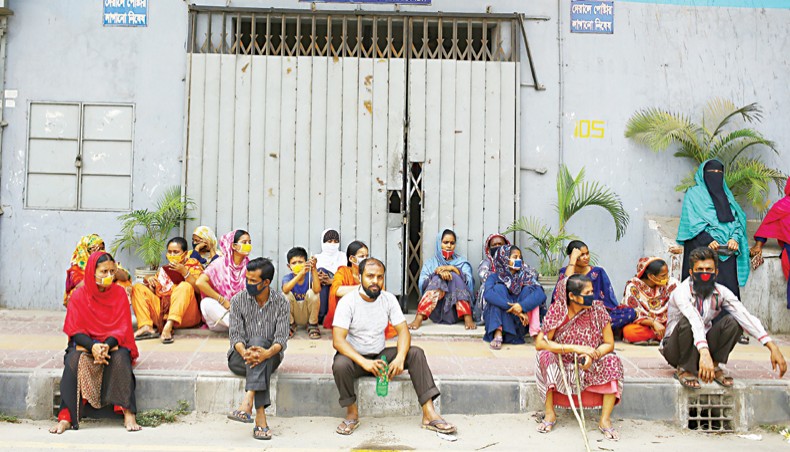 A file photo shows workers protesting against non-payment of wages in front of a readymade garment factory in the capital on April 16. More than 3.24 lakh readymade garment workers have lost their jobs and 1,915 factories, mostly subcontracting ones, have been shut since the coronavirus outbreak began in the country in March this year, according to a Bangladesh Institute of Labour Studies’ study report.— New Age photo