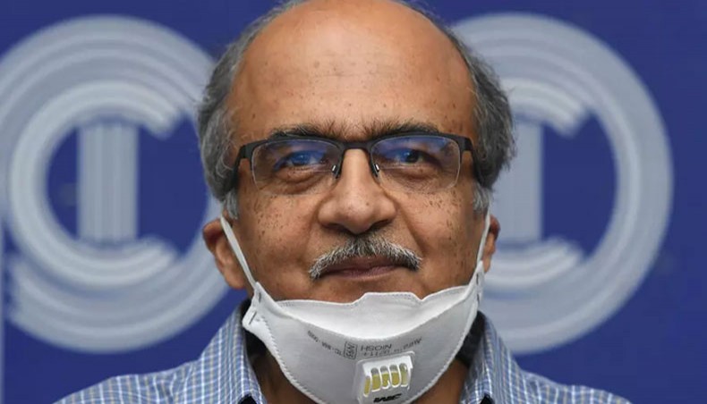 Prashant Bhushan smiles during a press conference in New Delhi after being fined a token one rupee for contempt of court. —AFP