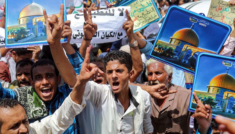 Demonstrators chant slogans with signs depicting Jerusalem’s Dome of the Rock alongside other signs reading in Arabic ‘no to normalisation with the Zionist entity’, during a protest in Yemen’s third city of Taez on August 21, 2020, against the US-brokered deal between the United Arab Emirates and Israel to normalise relations — AFP photo