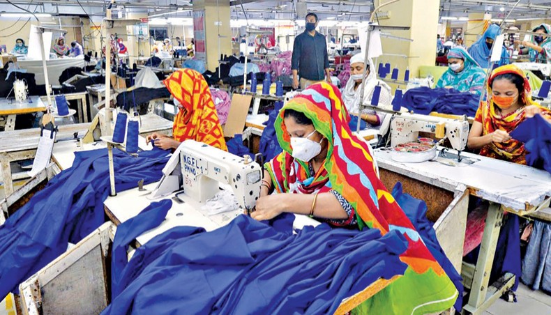 A file photo shows labourers wearing facemasks working at a garment factory in Dhaka recently. The country’s export earnings in July and August, the first two months of the current financial year 2020-21, grew by 2.17 per cent to $6.88 billion from $6.73 billion in the same period of FY20 as global businesses hit by the COVID19 pandemic started to rebound slowly.— AFP photo