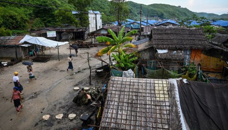 In this file photo taken on October 03, 2019 people walk in Kyauktalone camp in Kyaukphyu, Rakhine state, where Muslim residents have been forced to live for seven years after the inter-communal unrest tore apart the town. - AFP photo
