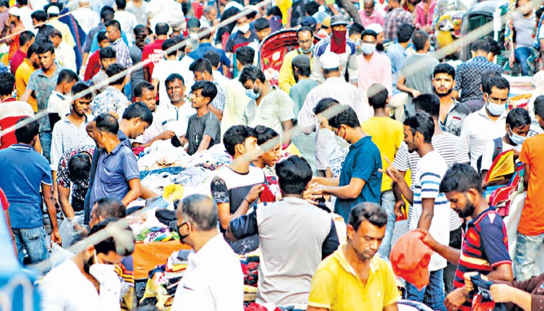 People move without wearing masks and maintaining physical distancing on a Gulistan Road in Dhaka on Thursday amid coronavirus outbreak. — New Age photo