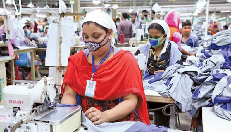 A file photo shows workers sewing clothes at a readymade garment factory in Dhaka. The country’s readymade garment exporters and economists said that they were cautiously optimistic about the positive growth of export earnings in the coming months as Bangladesh was yet to overcome the impact of the coronavirus outbreak. — New Age photo