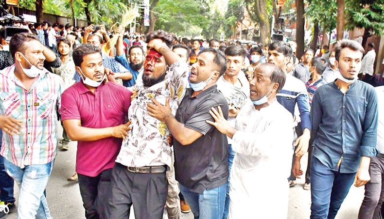 BNP activists take an injured fellow to a nearby hospital on Saturday following a clash between the supporters of two aspirants of party nomination for Dhaka 18 parliamentary by-election. — New Age photo