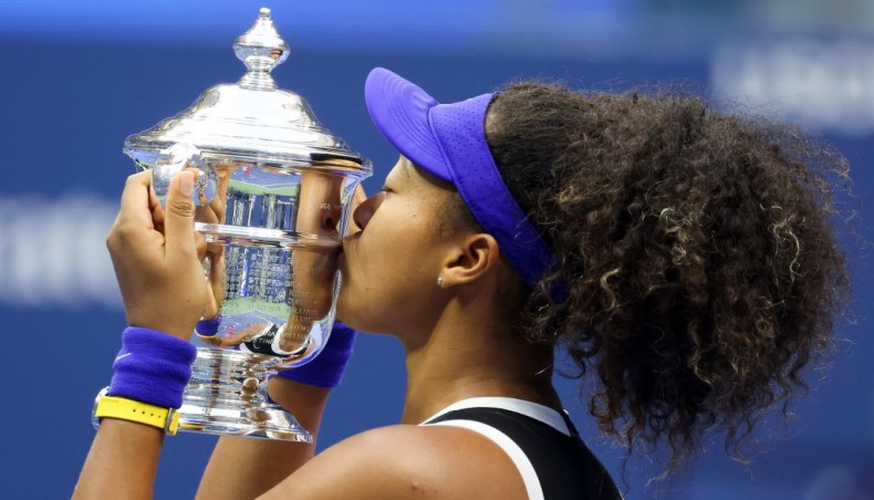 Naomi Osaka of Japan kisses the trophy in celebration after winning the US Open women's singles title at the USTA Billie Jean King National Tennis Centre in New York on Saturday. — AFP photo