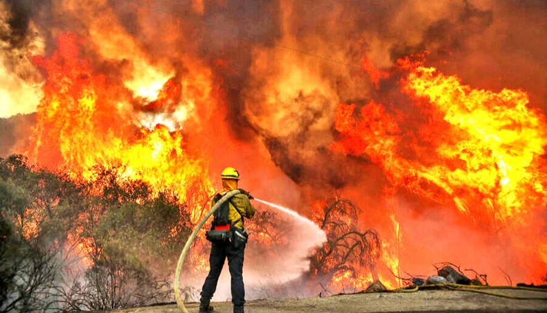 Firefighters battle a brush fire along Japatul Road during the Valley Fire in Jamul, California on September 6. — Agence France-Presse/Getty Images/Sandy Huffaker
