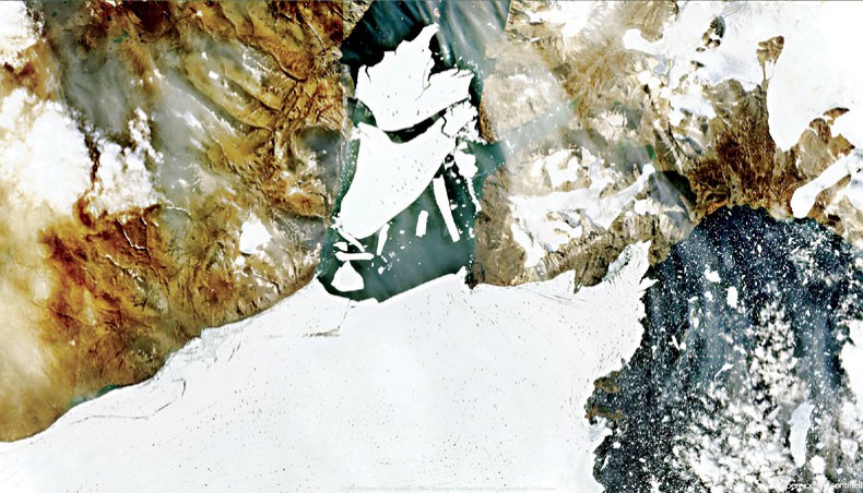 This handout satellite image captured on August 27 by the Copernicus Sentinel-2 mission and released by European Space Agency shows ice breaking off the Nioghalvfjerdsfjorden glacier in Northeast Greenland. — AFP photo
