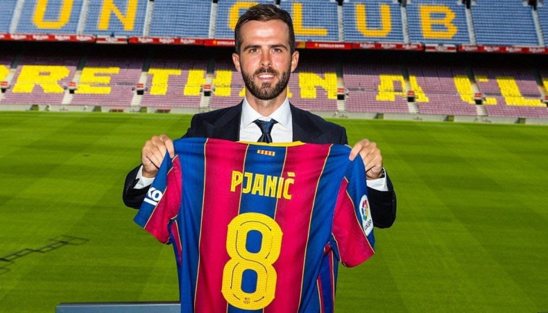 Barcelona’s new signing from Juventus, Miralem Pjanic, poses with his new team jersey during his presentation at the Camp Nou on Tuesday. — Twitter photo