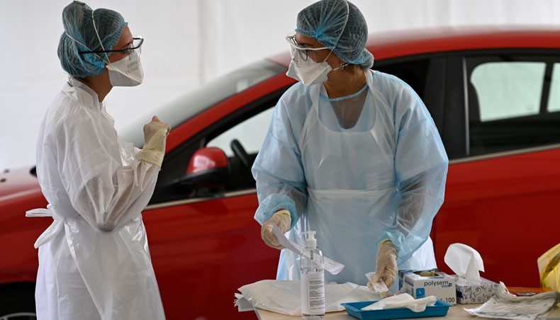 Health workers work during a COVID-19 test in a ‘Covid Drive’ at the University Hospital Centre in Rennes, western France, on September 7, 2020. — AFP photo