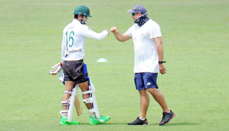 Bangladesh national cricket team coach Russell Domingo (R) does bump fist with batsman Lion Das during a training session at the Sher-e-Bangla National Stadium on Wednesday. — BCB photo
