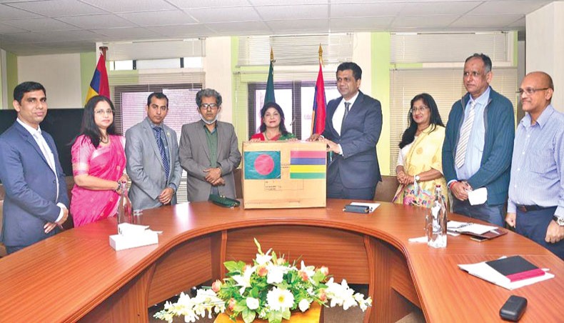 Bangladesh high commissioner to Mauritius Rezina Ahmed hands over PPEs to Mauritius environment minister Kavydass Ramano in Mauritius on Thursday as the country is in a state of environmental emergency. — Press release