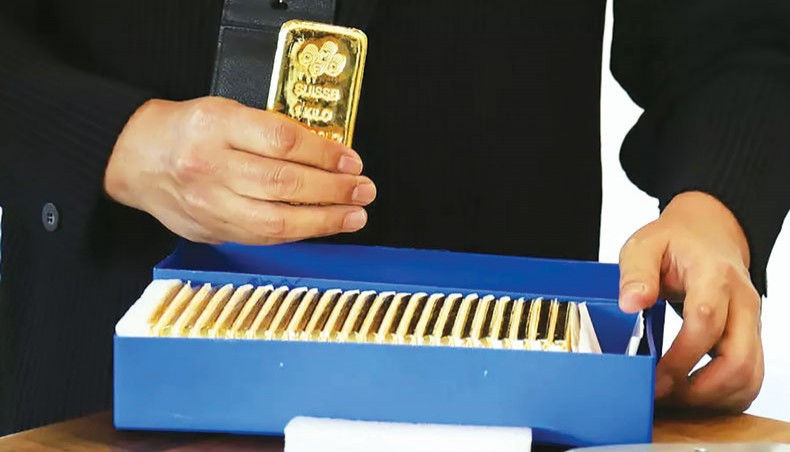 With the coronavirus fuelling demand for safe-haven assets for investors to park their cash, a Singapore exchange is offering mom-and-pop investors what it says is an easier way to get their hands on the precious metal. — AFP photo