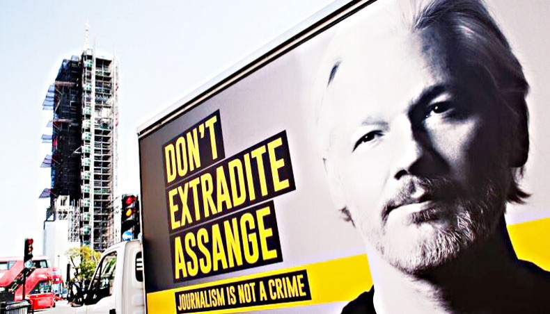 A billboard van calling for an end to extradition proceedings against WikiLeaks founder Julian Assange waits at traffic lights in Parliament Square in London, England, on September 14. — NurPhoto/David Cliff