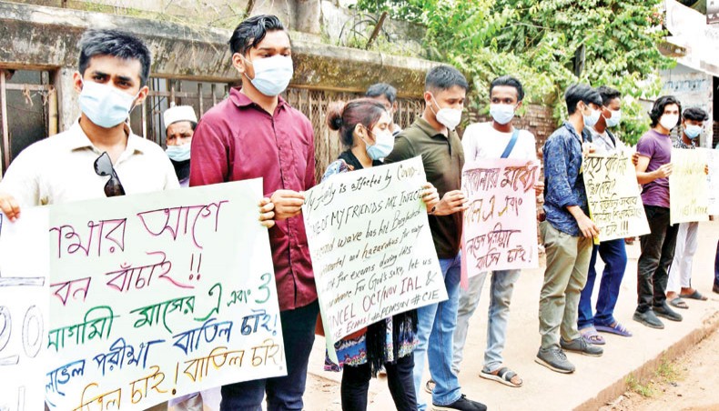 English medium students form a human chain in front of the National Press Club in Dhaka on Sunday demanding postponement of O-level and A-level examinations due to the coronavirus crisis. — New Age photo