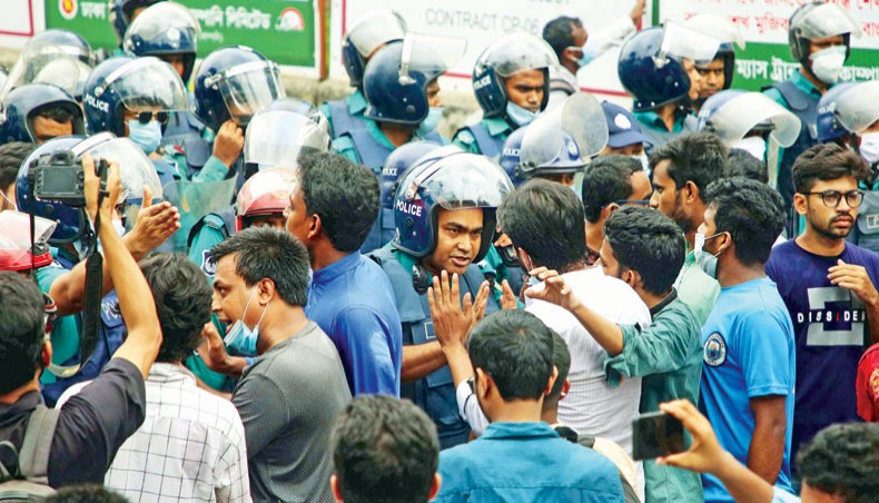 Police stop a procession of Chhatra Odhikar Parishad at Shahbagh brought out from the National Press Club in Dhaka on Tuesday protesting against the ‘police assault’ on them on Monday night. — Sony Ramany