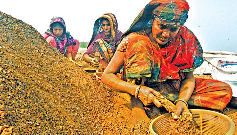 A file photo shows women separate iron from steel re-rolling mill wastes to recycle them at Rasulpur of Pagla in Narayanganj. — New Age/Indrajit Ghosh
