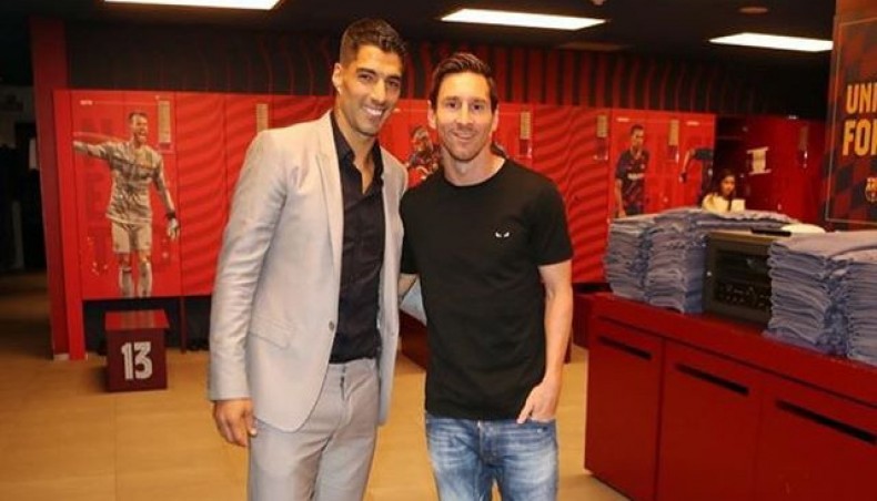 Barcelona captain Lionel Messi poses for a photograph with outgoing striker Luis Suarez at the club's dressing room on Thursday. -- Instagram photo