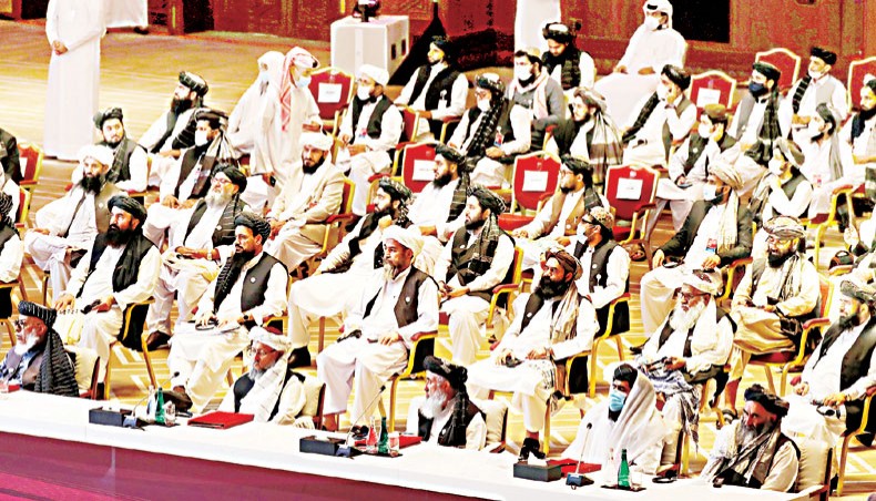 Members of the Taliban delegation attend the opening session of the peace talks between the Afghan government and the Taliban in the Qatari capital Doha on September 12. — Agence France-Presse/Karim Jaafar
