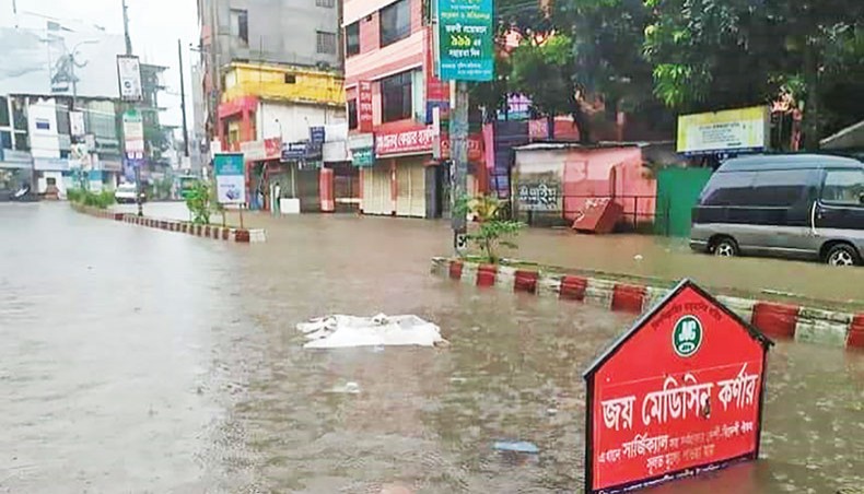 A submerged road at Dhap in Rangpur as record-breaking downpour on Sunday flooded the northern city. — New Age photo
