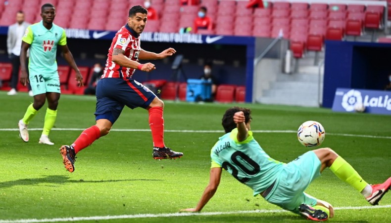 Atletico Madrid forward Luis Suarez (C) scores during their La Liga match against Granada at the Wanda Metropolitano stadium in Madrid on Sunday. — AFP photo