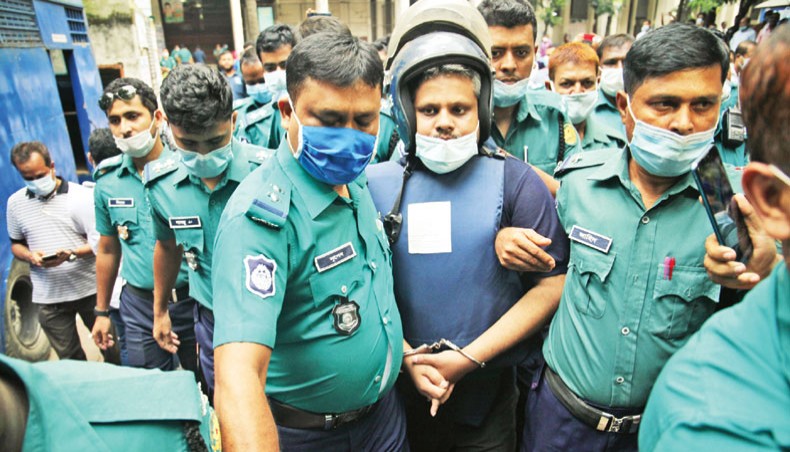 Police take Regent Group chairman Mohammad Shahed to jail from the Dhaka Metropolitan Special Tribuanl-1 on Monday after the court awarded life term imprisonment to him in an arms case. — New Age photo