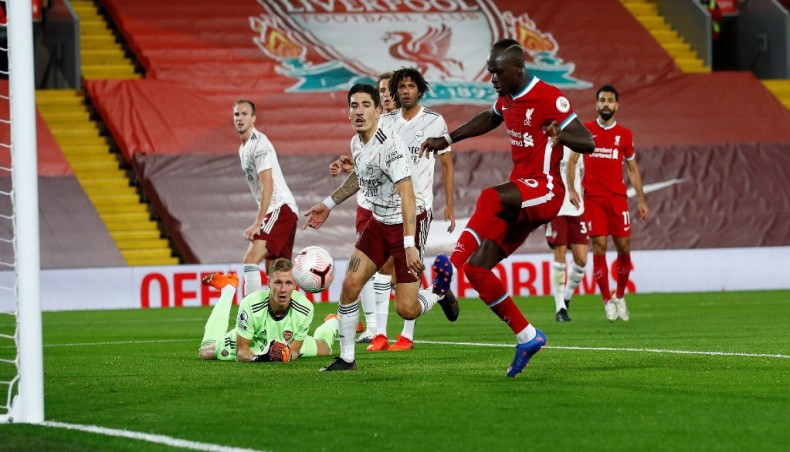 Liverpool forward Sadio Mane scores his team’s opening goal against Arsenal during their Premier League match at Anfield on Monday. — AFP photo