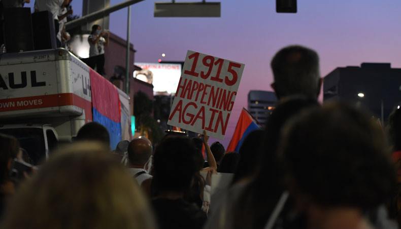 A person holds a placard during a protest organised by the Armenian Youth Federation outside the Azerbaijani Consulate General in Los Angeles on September 30, 2020 to protest what they call Azerbaijan's ‘aggression against Armenia and Artsakh’ — AFP photo