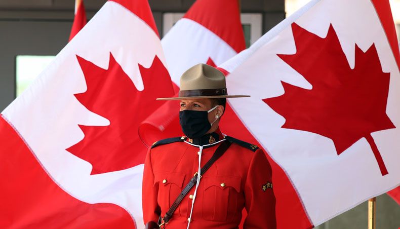 A Royal Canadian mounted police officer stands guard outside the Senate of Canada prior to the speech from the throne September 23, 2020 in Ottawa, Canada. — AFP photo