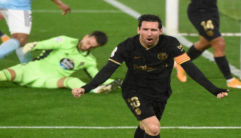Barcelona forward Lionel Messi celebrates after Celta Vigo defender Lucas Olaza scored an own goal during their La Liga match at the Balaidos stadium in Vigo on Thursday. — AFP photo