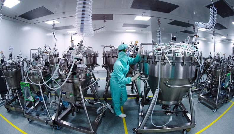In this file photo taken on July 10, 2020 lab technicians dedicated to the vaccines formulation, wearing Personal Protective Equipment, prepare stainless steel tanks for manufacturing vaccines preparations before the syringe filling phase, at a French pharmaceutical company Sanofi’s world distribution centre in Val-de-Reuil. — AFP photo