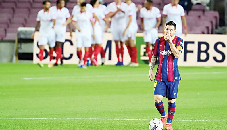 Barcelona forward Lionel Messi gestures during their La Liga match against Sevilla at the Camp Nou stadium in Barcelona on Sunday. — AFP photo