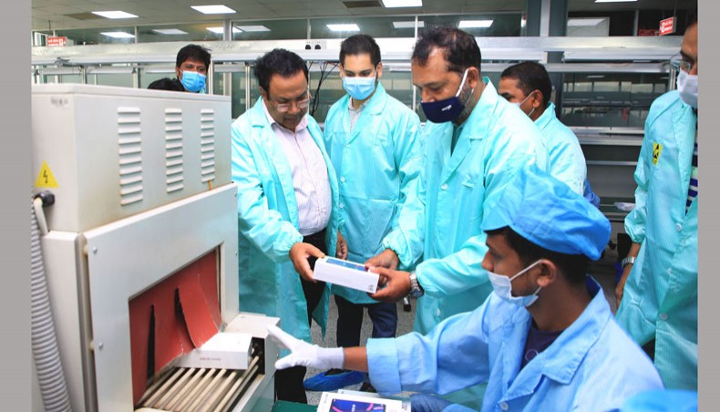 Bangladesh Telecommunication Regulatory Commission chairman Md Jahurul Haque Md Jahurul Haque inspects smart phone production at the Walton factory in Gazipur’s Chandra on Monday. — Press Release photo