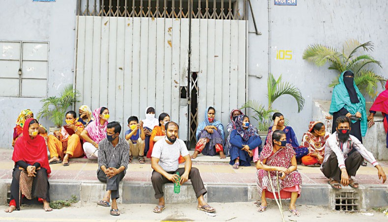 A file photo shows workers protesting against non-payment of wages in front of a readymade garment factory in the capital on April 16. The government has framed guidelines, allowing the export-oriented readymade garment and leather and footwear sectors workers, who were terminated due to the coronavirus outbreak in the country, to receive Tk 3,000 a month for three months.— New Age photo