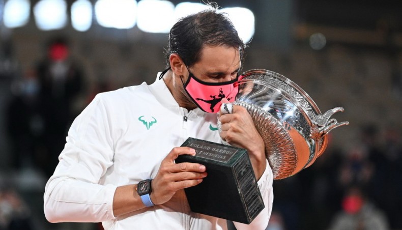 Spain's Rafael Nadal kisses the trophy after defeating Serbia's Novak Djokovic in the French Open men’s singles final at Roland Garros in Paris on Sunday. — AFP photo
