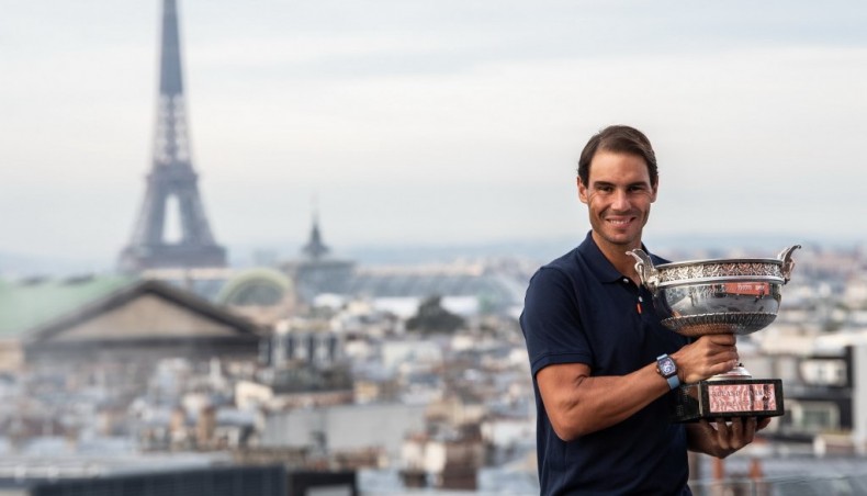 Spain’s Rafael Nadal poses with the French Open men’s singles trophy during a photocall in Paris on Monday. — AFP photo