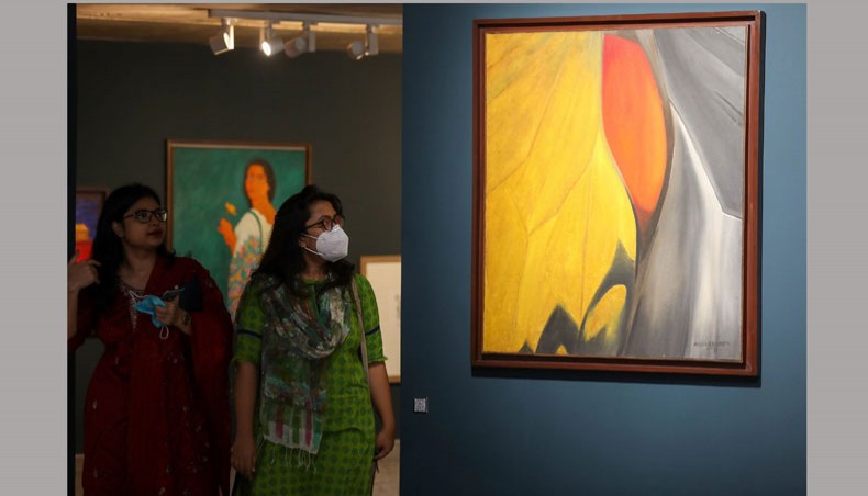 Visitors look at artworks by Murtaja Baseer at an exhibition at Bengal Shilpalay in the capital’s Dhanmondi on Monday. — Sourav Lasker